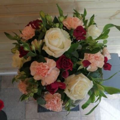 Peaches and cream - A flower arrangement in peach and cream presented in a ceramic pot
